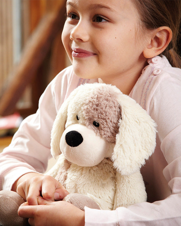 little girl holding a warmie