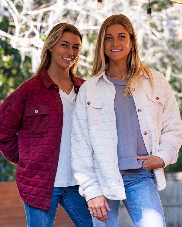 two women posing for the camera in palmetto moon shackets